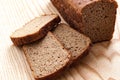 Black bread rye on a wooden background isolation Royalty Free Stock Photo