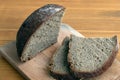 Black bread slices on the cutting board Royalty Free Stock Photo