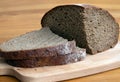 Black bread slices on the cutting board Royalty Free Stock Photo