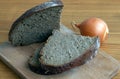 Black bread slices on the cutting board Royalty Free Stock Photo