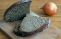 Black bread slices on the cutting board Royalty Free Stock Photo