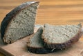 Black bread slices on the cutting board Royalty Free Stock Photo