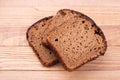 Black bread on wooden background Royalty Free Stock Photo