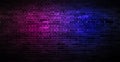 Black brick wall background rough concrete with neon lights and glowing lights. Lighting effect pink and blue on empty brick wall Royalty Free Stock Photo