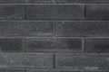 Black brick wall texture. Aged stone block masonry. Dark gloomy background Royalty Free Stock Photo