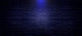 Black brick wall texture background with blue lighting effect for interior decoration. Royalty Free Stock Photo