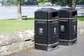 Black British bins at park at seaside