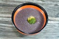 Black broccoli soup, purple soup made of blended broccoli, onion, garlic, meat soup, corn flour, salt, spices and black carrot Royalty Free Stock Photo