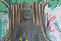 Black bronze Buddha statue, ancient and beautiful, in a Thai temple