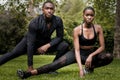 Black brother and sister twins doing exercise outdoors in stylish sportswear Royalty Free Stock Photo