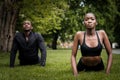 Black brother and sister twins doing exercise outdoors in stylish sportswear Royalty Free Stock Photo