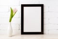 Black brown frame mockup with soft pink tulip in vase Royalty Free Stock Photo