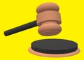 A black and brown judge gavel hammer and sound block bright yellow backdrop