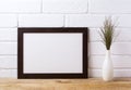 Black brown landscape frame mockup with dark grass in elegant v