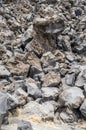 Black and brown rough volcanic rocks closeup