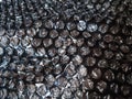 Black Bubble Wrap Or Air Cushion Film Abstract Horizontal Texture For Creative Artwork Background, Close Up, Top View, Copy Space Royalty Free Stock Photo