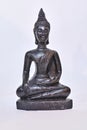 Black buddha meditating statue carved in stone