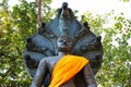 The black Buddha statue sheltered by naga hood