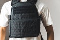 Black bullet proof vest on man body. No face