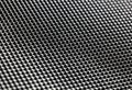 Black bumpy rubber surface used as a background. Black and white texture of rubber material with copy space. Bubble dots backgroun