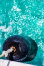 Abstract clear blue water portrait looking down on boat buoy