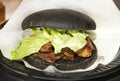 Black burger with foie gras Royalty Free Stock Photo