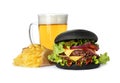 Black burger, French fries and glass of beer on white Royalty Free Stock Photo