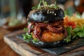 Black burger with fried octopus and vegetables