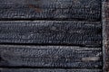 Black burned charred burnt wood background texture Royalty Free Stock Photo