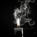 black burning candle with fire and smoke, close-up on black, black and white retro photo, sad funeral Royalty Free Stock Photo