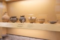 Black burnished jar, bowl, terracotta whorl and other pieces of ancient greek culture in a museum