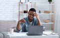 Black Business Man Having Headache Touching Head Sitting At Workplace Royalty Free Stock Photo