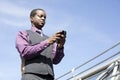 Black business man working with smart phone Royalty Free Stock Photo