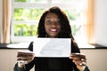 Black Business Woman Holding Pay Check Royalty Free Stock Photo