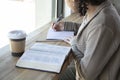 Black woman studies her bible and takes notes Royalty Free Stock Photo
