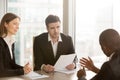 Black businessman convincing partners to sign document, negotiat Royalty Free Stock Photo