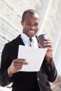 Black businessman drinking coffee Royalty Free Stock Photo