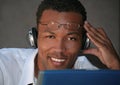 Black Businessman Listening to Music With Headphon