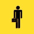 Black Businessman man with briefcase icon isolated on yellow background. Long shadow style. Vector