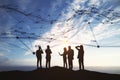 Black businesspeople silhouettes with abstract connection lines and indexes on dull sky backdrop. Communication, team, network and