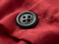black button on red textile Royalty Free Stock Photo