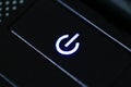 Black button start flashing blue light. Closeup Royalty Free Stock Photo