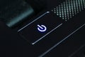 Black button start flashing blue light. Closeup Royalty Free Stock Photo