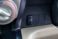 Button for turning electric headlight range adjustment of the car
