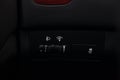 Black button for turning on and off the electronic system of vehicle stability control with a white icon and electric headlight Royalty Free Stock Photo