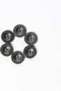 black buttons for sewing on a white background Royalty Free Stock Photo