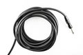 black cable for electric acoustic guitar isolated white background, music equipment