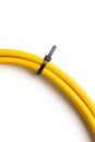 Black cable ties on yellow cable on white background. object picture for graphic designer Royalty Free Stock Photo