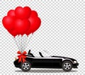 Black cabriolet car with bunch of red helium heart shaped balloons Royalty Free Stock Photo