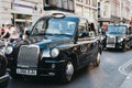 Black cabs on Oxford Street, London, UK. Royalty Free Stock Photo